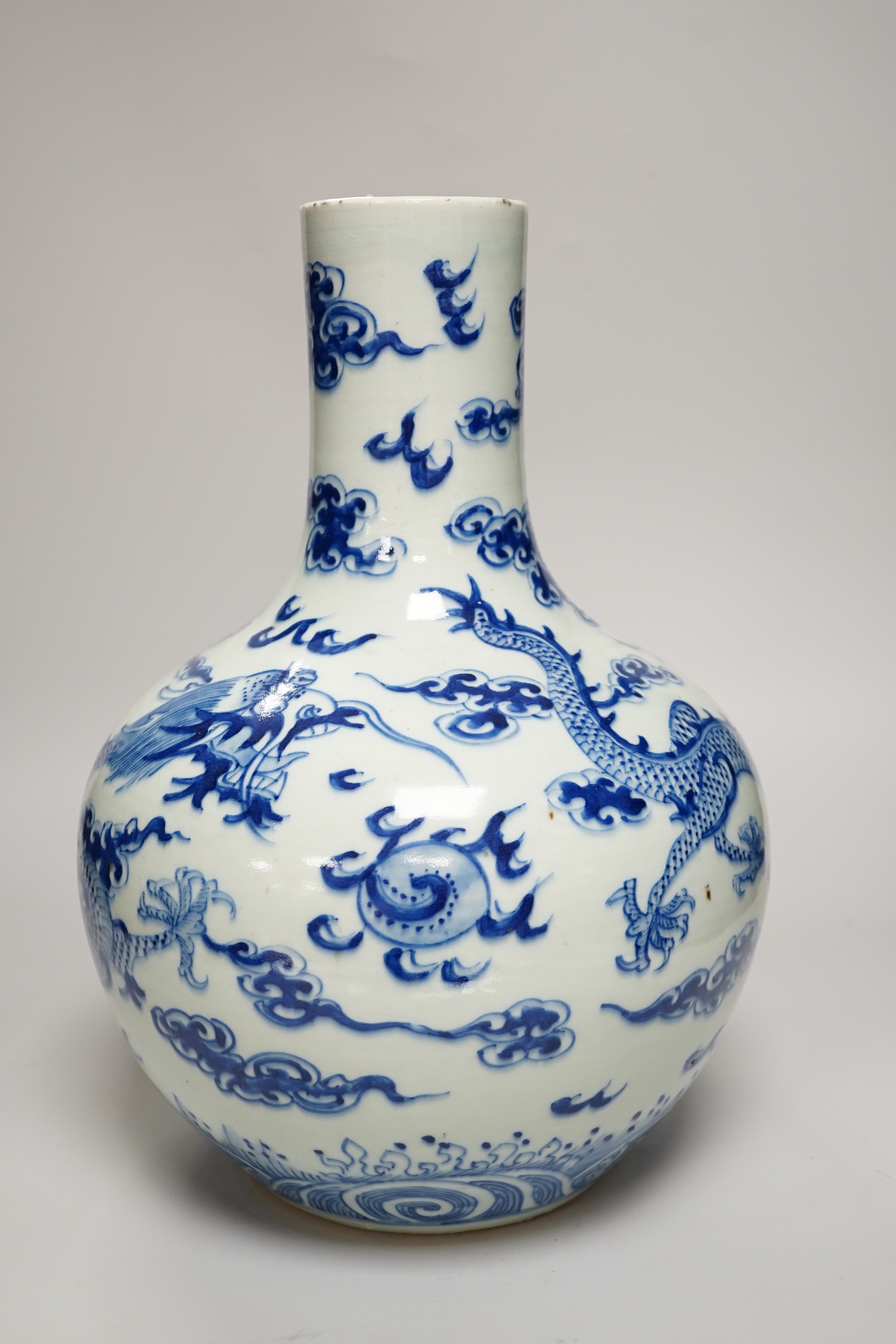 A Chinese blue and white ‘Dragon’ vase, tianqiuping, Qianlong mark but 19th century, 34cm